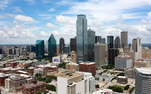 Downtown Dallas skyline under a blue sky