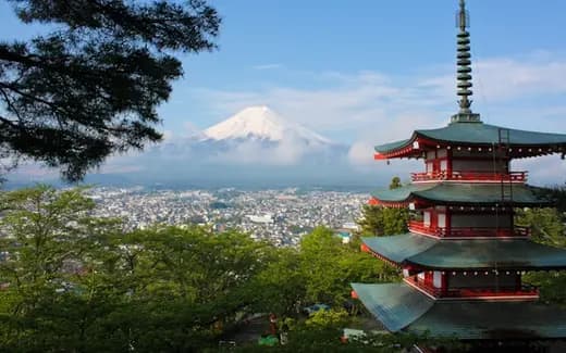 A pagoda with Mount Fuji behind it